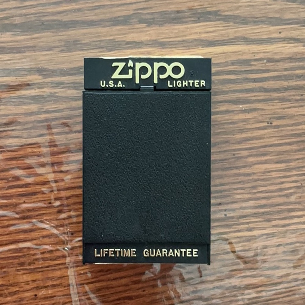 Zippo Black and Gold Lighter.
